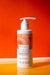 Aussie curls 250ml white glossy shampoo bottle with orange and white indigenous Australian artwork